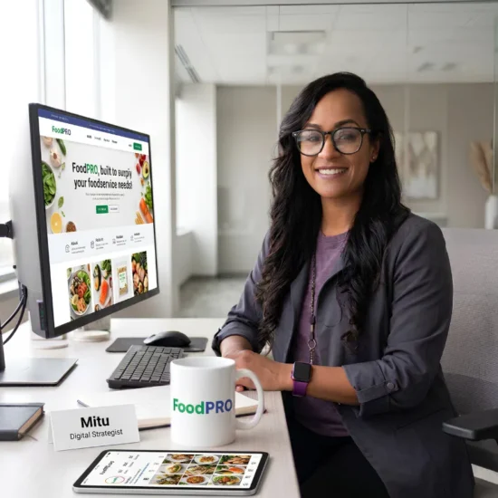 Digital strategist presenting FoodPRO foodservice software solution on computer screen for food suppliers and distributors.