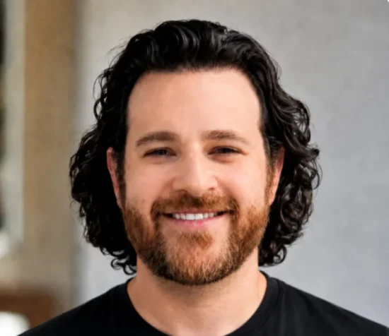 Professional headshot of a man wearing a Maverick branded shirt, suitable for food service and wholesale distribution industry business profiles.